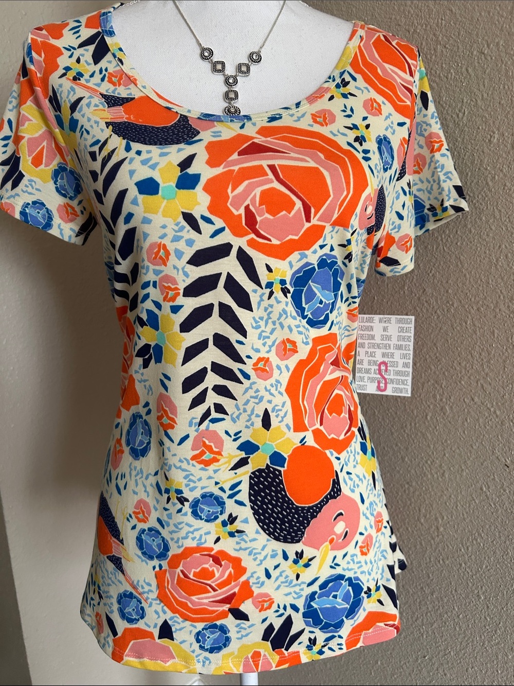 LuLaRoe Cream Short Sleeve Tee with Orange, Blue & Yellow Floral Print